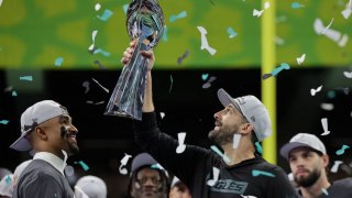 Philadelphia Eagles head coach Nick Sirianni and quarterback Jalen Hurts celebrate with the Vince Lombardi Trophy after winning Super Bowl 59.