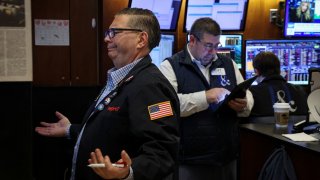 Traders work on the floor at the New York Stock Exchange (NYSE) in New York City, U.S., February 12, 2025. 