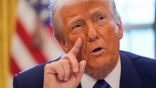 U.S. President Donald Trump speaks, as he signs an executive order in the Oval Office, at the White House in Washington, D.C., U.S. Feb. 14, 2025. 