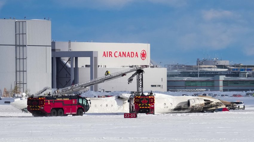 First responders work at the Delta Air Lines plane crash site at Toronto Pearson International Airport in Mississauga, Ontario, Canada February 17, 2025.