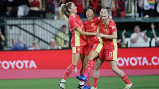 Hina Sugita #8 of the Portland Thorns celebrates with teammates after scoring a goal during the second half against the Seattle Reign at Providence Park on May 11, 2024 in Portland, Oregon. 