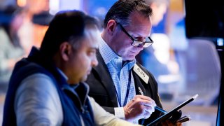 Traders work at the New York Stock Exchange on Feb. 26, 2025.