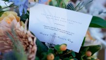 A note inside a flower arrangement is seen during a Valentine's Day Widow Outreach Project event, Friday, Feb. 14, 2025, in Charlotte, N.C.  (AP Photo/Erik Verduzco)