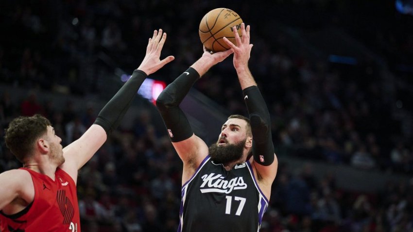 Feb 6, 2025; Portland, Oregon, USA; Sacramento Kings center Jonas Valanciunas (17) shoots a jump shot during the second half against Portland Trail Blazers center Donovan Clingan (23) at Moda Center. Mandatory Credit: Troy Wayrynen-Imagn Images