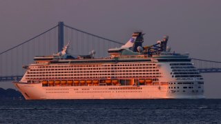 The Royal Caribbean Adventure of the Seas cruise ship pulls into its dock in Bayonne, New Jersey, as the sun rises on Sept. 15, 2022.