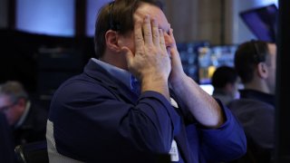 A trader reacts on the floor of the New York Stock Exchange on Feb. 25, 2025.