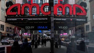 People walk past an AMC theatre in Manhattan in New York City, U.S., February 25, 2025. 