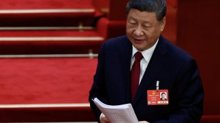 Chinese President Xi Jinping stands to leave after the opening session of the National People’s Congress (NPC) at the Great Hall of the People in Beijing, China, March 5, 2025. 
