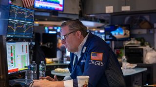 Traders work on the floor of the New York Stock Exchange (NYSE) on March 05, 2025, in New York City. F
