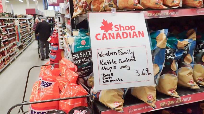 A “Shop Canadian” sign is seen at the entrance of a supermarket in Vancouver, British Columbia, Canada, March 4, 2025. 