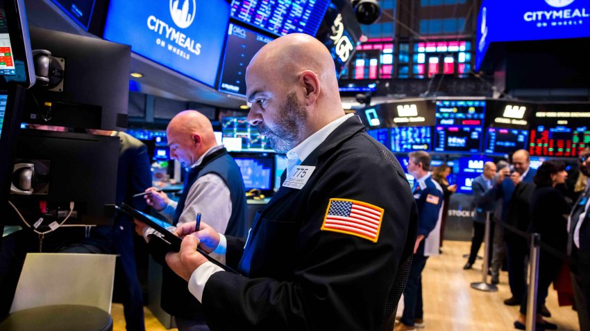 Traders work on the floor of the New York Stock Exchange on March 6, 2025. 