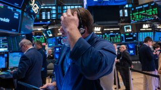 Traders work on the floor of the New York Stock Exchange (NYSE) on March 12, 2025 in New York City.