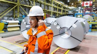 Canada’s Prime Minister-designate Mark Carney prepares to speak to workers while he visits the ArcelorMittal Dofasco steel mill in Hamilton, Ontario, Canada March 12, 2025. 
