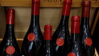 Bottles of wine are seen on display for sale in a wine shop in Paris, France, March 13, 2025. 