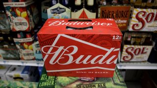 A twelve pack of Budweiser sits on a shelf for sale at a convenience store in New York City.