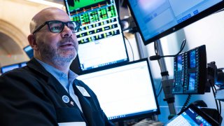 Traders work on the floor of the New York Stock Exchange on March 17, 2025.