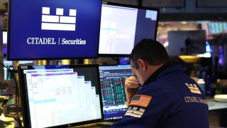 Traders on the floor of the New York Stock Exchange on March 14, 2025, at the opening bell.