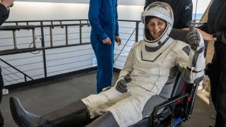 NASA astronaut Suni Williams is helped out of a SpaceX Dragon spacecraft onboard the SpaceX recovery ship MEGAN after she, NASA astronaut Nick Hague, and Butch Wilmore, and Roscosmos cosmonaut Aleksandr Gorbunov landed in the water off the coast of Tallahassee, Florida, Tuesday, March 18, 2025.