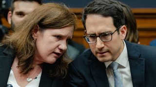 Federal Trade Commission Commissioners Rebecca Kelly Slaughter (L) chats with Alvaro Bedoya (R) before FTC Chair Lina Khan testifies during a House Judiciary Committee hearing in the Rayburn House Office Building on Capitol Hill in Washington, DC on July 13, 2023.