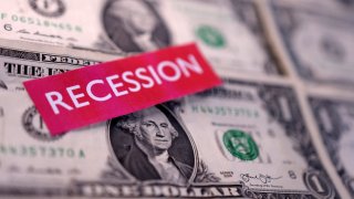 U.S. dollar banknotes and a label with the word “Recession” are seen in this illustration taken March 19, 2025.