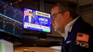 A television station broadcasts the Federal Reserve’s decision to leave rates unchanged, on the floor of the New York Stock Exchange on March 19, 2025.