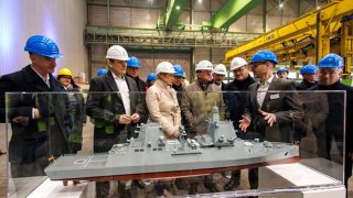 Thyssenkrupp marine systems CEO Oliver Burkhard (4th R), German Defence Minister Boris Pistorius (6th R) and Mecklenburg-Western Pomerania’s State Premier Manuela Schwesig (8th R) during their visit of a shipyard of Thyssenkrupp Marine Systems that will build military submarines on Jan. 17, 2025 in Wismar, Germany.