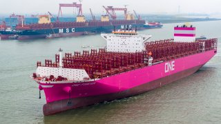 SUZHOU, CHINA – MARCH 18: ‘ONE FOREVER’ container ship, with a length of 366 meters and width of 51 meters, is assisted by tugboats as it prepares to leave a dockyard of Jiangsu Yangzi-Mitsui Shipbuilding Co., Ltd. on March 18, 2024 in Suzhou, Jiangsu Province of China.