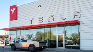 A Tesla Cybertruck is parked in front of a showroom on March 20, 2025 in Austin, Texas.