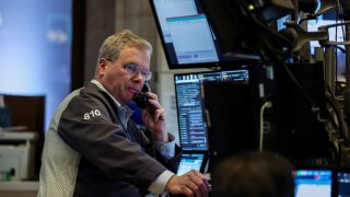 A trader works at the New York Stock Exchange in New York City, U.S., March 24, 2025.