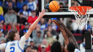 Cooper Flagg #2 of the Duke Blue Devils defends Jason Asemota #5 of the Baylor Bears during the second round of the 2025 NCAA Men’s Basketball Tournament held at Lenovo Center on March 23, 2025 in Raleigh, North Carolina.
