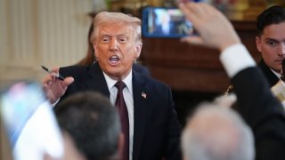 U.S. President Donald Trump greets members of the audience after signing a proclamation during a Greek Independence Day celebration at the White House on March 24, 2025 in Washington, DC.