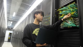 An engineer conducts an inspection in a data center on February 13, 2025 in Urumqi, Xinjiang Uygur Autonomous Region of China. Chinese artificial intelligence firm DeepSeek has launched operations in the city to host computing power infrastructure to support its large language model. (Photo by VCG/VCG via Getty Images)