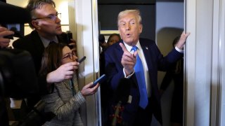 U.S. President Donald Trump speaks to members of the media aboard Air Force One before landing in West Palm Beach, Florida, U.S., March 28, 2025. 