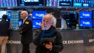 Traders work on the floor of the New York Stock Exchange on March 28, 2025, in New York City.
