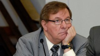 FILE – North Dakota Sen. Ray Holmberg listens during a joint House and Senate Appropriations Committee meeting at the state Capitol, Jan. 7, 2009, in Bismarck, N.D. On Thursday, Oct. 26, 2023, the former, longtime North Dakota lawmaker was indicted on federal charges alleging he traveled to Prague for sex with a minor and also received child pornography. He is charged with two counts: travel with intent to engage in illicit sexual activity, and receipt and attempted receipt of child pornography.