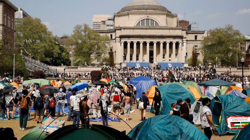 FILE – Student protesters gather inside their encampment on the Columbia University campus, April 29, 2024, in New York.