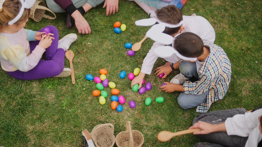 A group of children and parents are gathering at a family garden for Easter event.