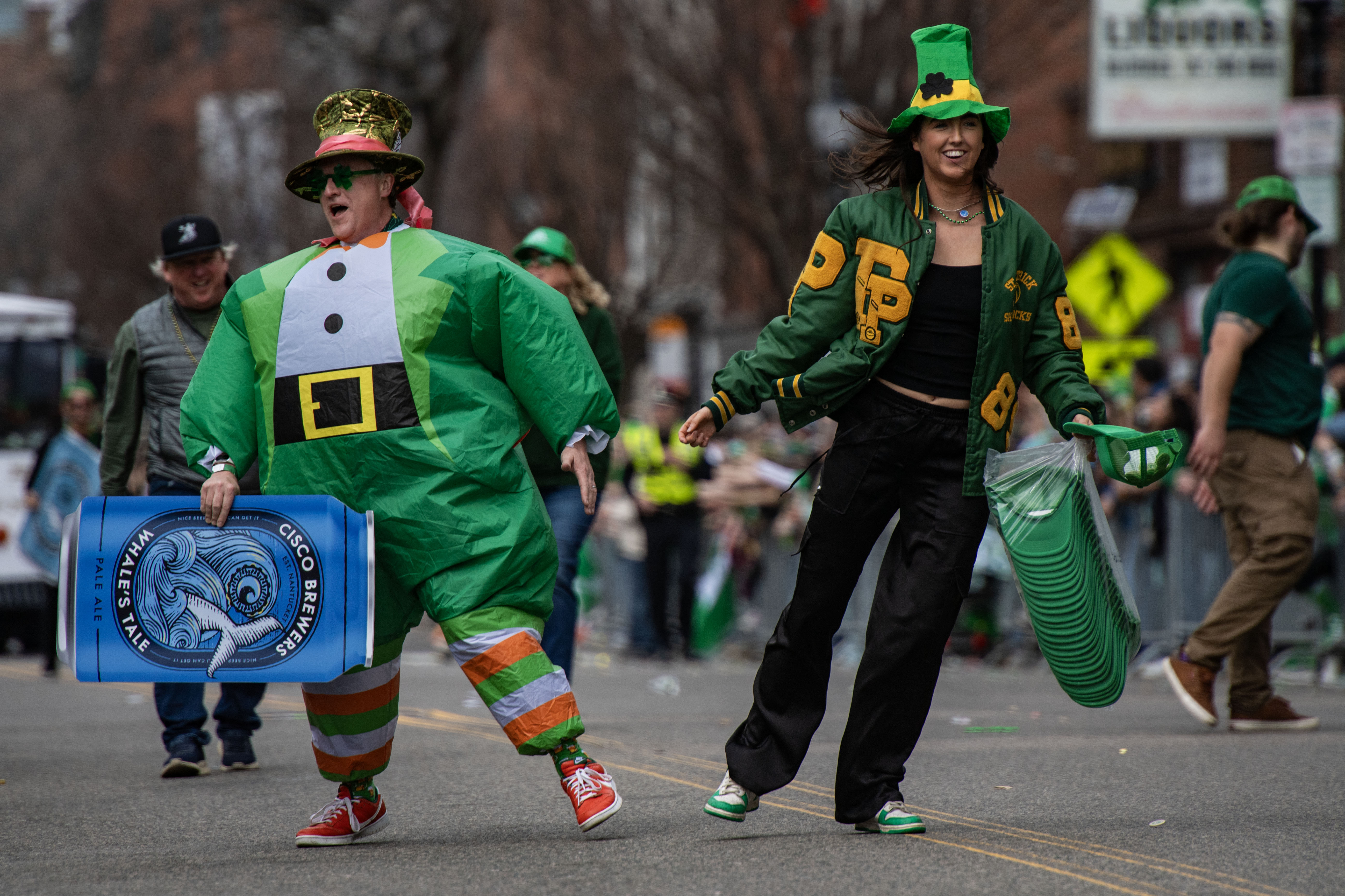 People dressed as leprechauns dance during the annual St. Patrick's Day parade in Boston