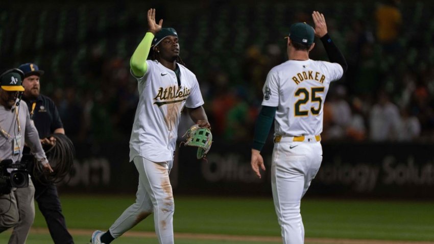 Jul 23, 2024; Oakland, California, USA;  Oakland Athletics outfielder Lawrence Butler (4) and outfielder Brent Rooker (25) celebrate after defeating the Houston Astros at Oakland-Alameda County Coliseum. Mandatory Credit: Stan Szeto-USA TODAY Sports
