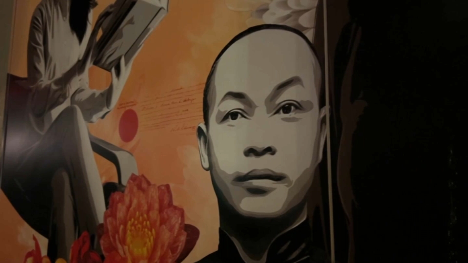 A mural featuring a man's portrait with flowers and abstract elements
