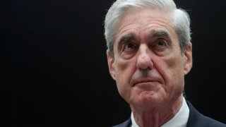 FILE PHOTO: Former Special Counsel Robert Mueller stands before the House Judiciary Committee as he prepares to testify at a hearing on the Office of Special Counsel’s investigation into Russian Interference in the 2016 Presidential Election” on Capitol Hill in Washington, U.S., July 24, 2019.