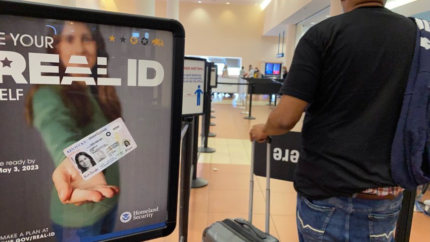 Homeland Security sign for REAL ID at entrance to passenger TSA security area, West Palm Beach, Florida.