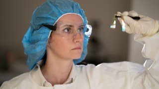 Stephanie Rider of Precision Neuroscience inspects the company’s microelectrode array.