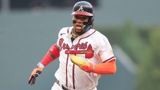 Atlanta Braves right fielder Ronald Acuña Jr., #13, heads to third base during the Tuesday evening MLB game between the Arizona Diamondbacks and the Atlanta Braves at Truist Park in Atlanta on July 18, 2023.