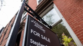A sign advertising a home for sale is displayed outside of a Manhattan building on April 11, 2024 in New York City.