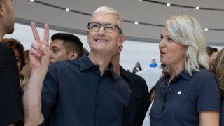 Apple CEO Tim Cook poses as Apple holds an event at the Steve Jobs Theater on its campus in Cupertino, California, on Sept. 9, 2024.