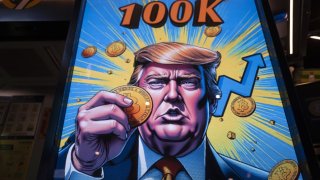A cartoon image of US President-elect Donald Trump holding a Bitcoin token to mark the cryptocurrency reaching over $100,000 displayed at a Coinhero store in Hong Kong, China, on in Hong Kong, China, on Thursday, Dec. 5, 2024.