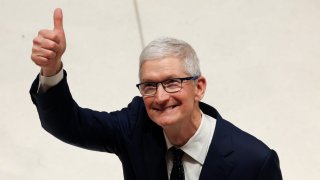 Chief Executive of Apple, Tim Cook gives a thumb’s up during a tour the Apple Headquarters on December 12, 2024 in London, England.