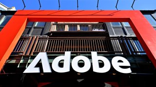 An Adobe sign hangs along Main Street during the 2025 Sundance Film Festival on Jan. 27, 2025 in Park City, Utah.