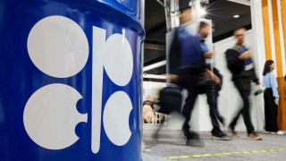 FILE PHOTO: People walk past an installation depicting barrel of oil with the logo of Organization of the Petroleum Exporting Countries (OPEC) during the COP29 United Nations climate change conference in Baku, Azerbaijan November 19, 2024. 